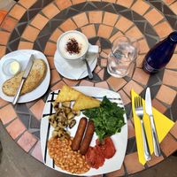 Vegan english breakfast with soy milk cappuccino at Mango Cafe in Mijas