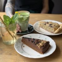 Frangipane and chocolate mousse hazelnut cake, with the house iced tea and iced matcha latte  at Blackbird in Bruges