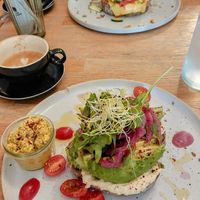 Toast Avocado (the best you'll ever eat in your life) a side of scrambled tofu and a delicious toast Kimchi 👌🏻 at Blackbird in Bruges