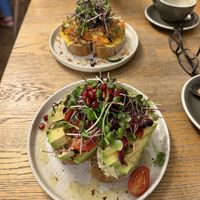 Toast, avocado, and toast kimchi in the background  at Blackbird in Bruges