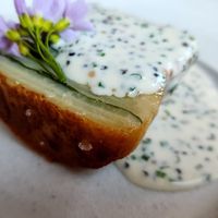 Layers of potatoes, herbs in the middle w/creamy horseradish sauce and land caviar at Ark in Copenhagen