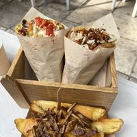 Pitas and home made fries with cheese and bacon   at Cookoomela Grill in Athens