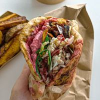 Wolt order, pink beetroot souvlaki   at Cookoomela Grill in Athens
