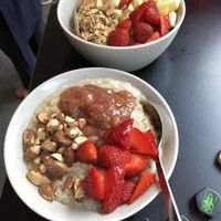 Oatmeal with rhubarb compote, strawberries and almonds in front (vegan); with caramel, granola and apples in the back (I’m sure the caramel contains dairy). Yum! at GRØD -Torvehallerne in Copenhagen