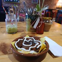 Yummy vegan nachos and vegan iced matcha latte at Charlie Friday's in Lynton