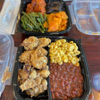 Four items on my plate: mac&cheese, red beans, cauliflower wings, and bread pudding  at Sweet Soulfood in New Orleans
