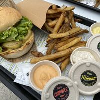 Seitan burger, fries, and 3 different sauces (chipotle, mustard curry, and aioli dill) at Greenpoint Burgers in Annecy