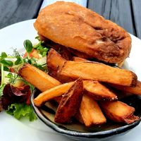 Fried banana blossom sandwich, chips and greens at Dr Legumes in Folkestone
