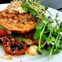 Roasted tomato crumble tart w/smoked cheese on a bed of veggies at Dr Legumes in Folkestone