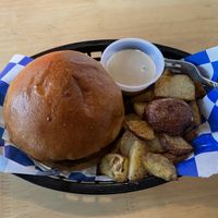 Just impossible breakfast sandwich and a side of home fries. The sandwich is impossible sausage, just egg, Daiya cheese on a potato roll. With their vegan grindhouse sauce.  at The Grind House in Bangor