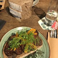 Vegan Soup of the Day and a stack of bread.  The other vegan dish whose name I have forgotten is tempeh and tapenade    at De Republiek in Bruges