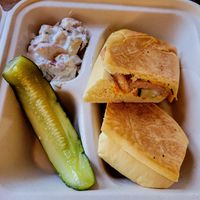 Cuban sandwich with a side of potato salad at Falcon Coffee Bar in Nashville