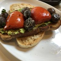 Avocado toast with roasted tomatoes and miso mushrooms  at Bills in Honolulu