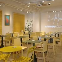 Bright, clean interior in yellow and green — a calm and welcoming space just minutes from Omotesando Station. Perfect for a mindful lunch, solo visit or catch-up with friends. at L for You in Tokyo