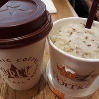 Turmeric latte with coconut-rice milk and quinoa porridge at LGW - Pret A Manger -  ST in Horley