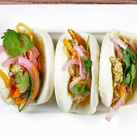 Vegan Bao Sliders

King oyster mushrooms, carrots, daikon, cabbage, leek, tofu stuffed into steamed bao bun. at Dundas in Vancouver