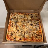 Large square beautiful juicy vegan pizza with melty vegan cheese at Cousin Vinnie's NY Pizza Cafe in San Juan Island