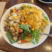 Tofu scramble plate with peppers and onions, spinach, and extra potatoes  at Nori's Village Market in Saranac Lake