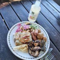 Lasagne, grilled veggies, vegan sausages, pasta salad, roasted potatoes, olive spread, pesto. at Hermans in Stockholm