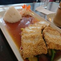 Sesame tofu in teriyaki sauce with tiny dome of rice. at Good Morning Vietnam Vegan in Berlin