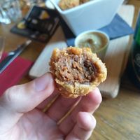 Vegan bitterballen: a stew-based snack served with mustard at Brouwerij Het Anker in Mechelen