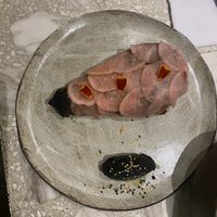 Smoked eggplant covered in radishes and served with a smoky black sesame sauce    at Casa Lėlytė in Bogota