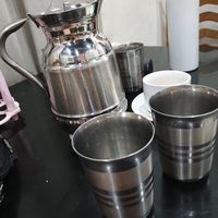 Stainless steel jug & cups free filtered water. at Grandma's Kitchen in Kochi
