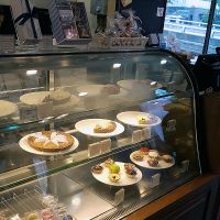 Interior of location, view towards cashier and display of tartes at La Bonne Tarte in Seoul