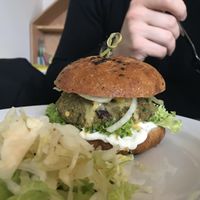 Boyfriend´s burger made from delicious bun.  at Roots Fresh Food Bistro in Prague