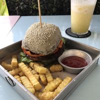 Asian dance party burger with fries and smoothe at Black House Burgers in Kuta