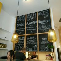 big menu on the wall at Falafeleria - Sta Barbara in Madrid