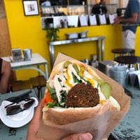 stuffed falafel with lots of veggies sauces and hot falafels/pita at Falafeleria - Sta Barbara in Madrid