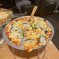 St Louis style pizza with Follow Your Heart mozzarella, red onions, spinach, and corn.   at Waldo Pizza in Kansas City