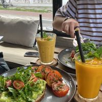 Avo on toast with a mango juice! Smoothie is not vegan  at Machinery Cafe in Canggu