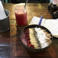Smoothie bowl with maqui berries, strawberries, blueberries and almond milk. Topped with granola, coconut flakes, chia seeds and goji berries. at Namaskara Coffee & Superfoods in Ubud