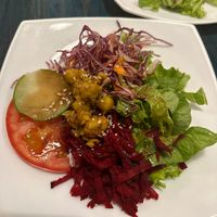 Side salad with beets and chickpeas comes with entree at Stashus Con Fusion in Puerto Viejo De Talamanca