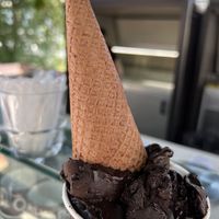 Chocolate/raspberry gelato with cone on top  at Kavarna Cacao in Ljubljana
