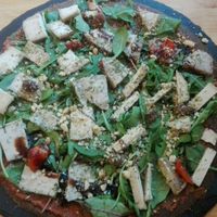 Pizza with four sorts of Cashew cheeses at The Raw Kitchen Malmö in Malmo