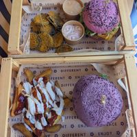 Parmagiana (purple) and cherry bomb (pink) with breaded aubergines and patas buenas (not too spicy, very tasty!) at Flower Burger in Bergamo