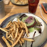 Hamburger no wrap acompanhado de deliciosas batatas fritas. Delicioso😄 at Raiz in Sintra