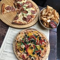 Zucho vegan pizza (bottom) and vegan chips at Winnies in Queenstown