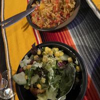 Rice (very spicy and a bit mushy) and salad as sides with nachos  at El Castillo in Valkenburg