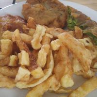 Pineapple rings, Hullish patty & pea fitter with chips. at Gabby's Chippy in Bridlington