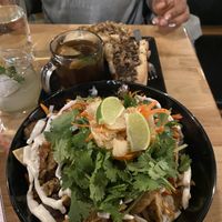 Vegan banh mi nachos & vegan cheesesteak with “pho cup" at 98 Center Moab in Moab