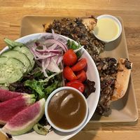 Vegan cheesesteak with a side salad (top dressing is vegan orange and bottom is vegan black garlic)   at 98 Center Moab in Moab