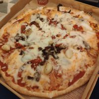 Sun dried tomatoes, vegan cheese, whole roasted garlic pizza at Mod Pizza - Pinnacle Building in Leeds