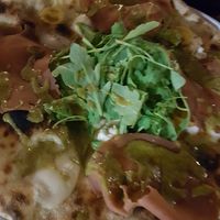 Personal creation: cashew mozzarella with vegan mortadala, pistachio cream and arigla. Just 8 euros at Lore Pizzeria in Lecce