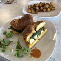 Tofu “egg” breakfast sandwich and home fries   at Common Roots Cafe in Rye