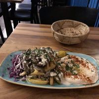 Grilled oyster mushrooms with hummus and fries   at Hummus Küch' in Frankfurt