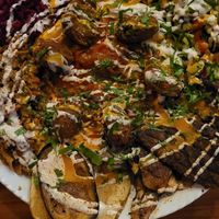 Platten for two : shawarma, oyster mushrooms, hummus, schakschuka, falafel, salads,  eggplant and potatoes at Hummus Küch' in Frankfurt